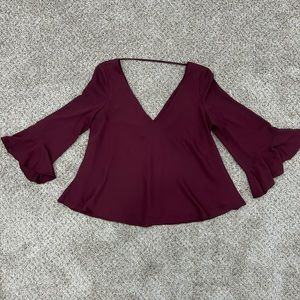 Amanda Uprichard maroon shirt